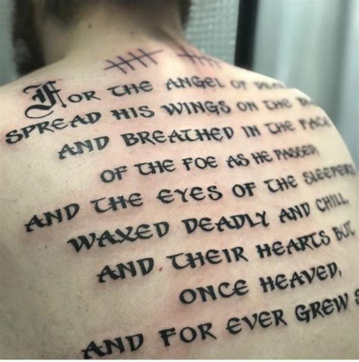 What does pams back tattoo say?